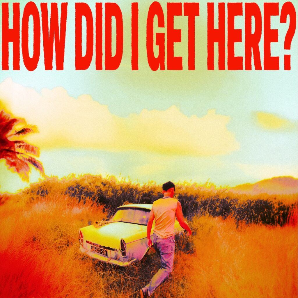 Albumcover. Sonnenschein, ein Auto steht in einer Wiese, man sieht Tomlinson von hinten, er geht seitlich am Auto vorbei